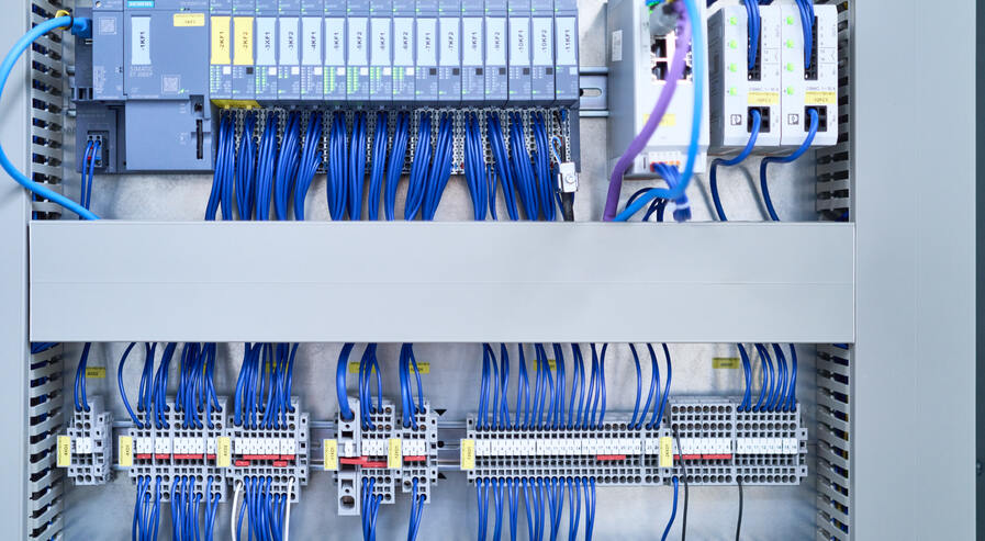 Control cabinet with cable