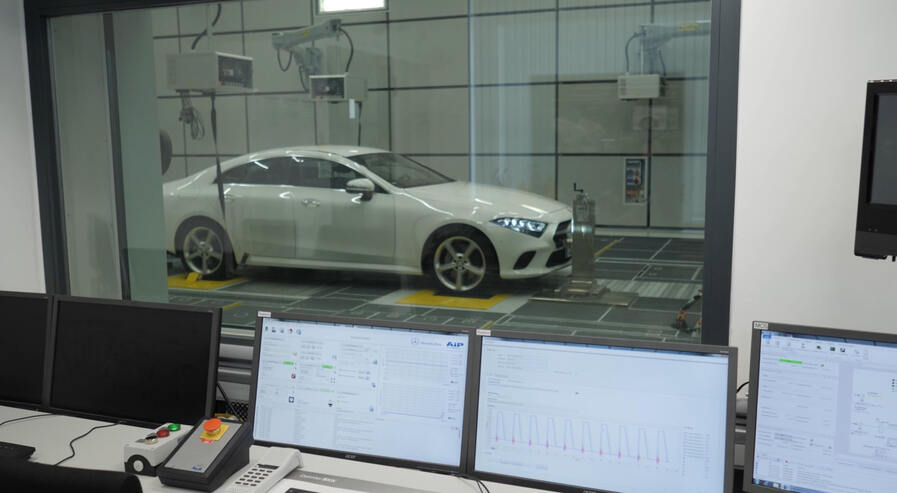 Measurement data in the control room with a car in the background