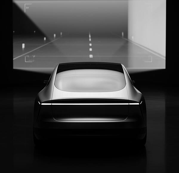 Fahrzeug vor einer Leinwand mit Fahrbahn